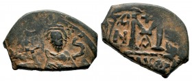 ARAB-BYZANTINE. Early Caliphate (636-660). Ae Fals. 
Condition: Very Fine

Weight: 6,08 gr
Diameter: 17,20 mm