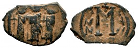 ARAB-BYZANTINE. Early Caliphate (636-660). Ae Fals. 
Condition: Very Fine

Weight: 4,24 gr
Diameter: 18,30 mm