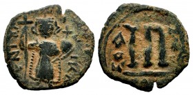 ARAB-BYZANTINE. Early Caliphate (636-660). Ae Fals. 
Condition: Very Fine

Weight: 3,20 gr
Diameter: 19,75 mm