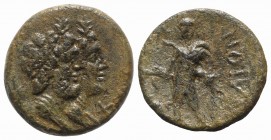 Sicily, Katane, late 3rd century BC. Æ (16mm, 4.70g, 6h). Jugate busts of Serapis and Isis; grain-ear behind. R/ Apollo standing slightly l., leaning ...