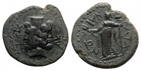 Sicily, Katane, c. 2nd century BC. Æ (25mm, 9.48g, 11h). Janiform head of Serapis; three monograms around. R/ Demeter standing l., holding grain ears ...