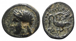 Ionia, Leukai, c. 380-360 BC. Æ (10mm, 1.65g, 3h). Herakleion, magistrate. Laureate head of Apollo l. R/ Swan standing l. with open wings. Cf. Kinns, ...