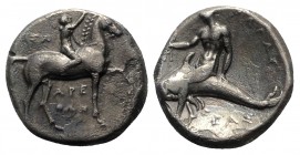 Southern Apulia, Tarentum, c. 302-280 BC. AR Nomos (20mm, 7.65g, 1h). Youth on horseback r., crowning horse; ΣA to l., APE/ΘΩN in two lines below. R/ ...