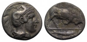 Southern Lucania, Thourioi, c. 350-300 BC. AR Stater (20mm, 7.64g, 5h). Helmeted head of Athena r., helmet decorated with Skylla throwing stone. R/ Bu...