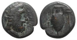 Bruttium, Hipponion, late 4th-early 3rd centuries BC. Æ (20mm, 8.30g, 12h). Laureate head of Zeus r. R/ Amphora; kerykeion to r. HNItaly 2249; SNG ANS...