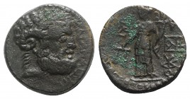 Sicily, Katane, c. 2nd century BC. Æ (20mm, 9.67g, 12h). Laureate head of Zeus Ammon r. R/ Dikaiosyne standing l., holding scales and cornucopia; mono...
