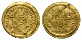 Justinian I (527-565). AV Solidus (21mm, 4.33g, 6h). Constantinople, 545-565. Helmeted and cuirassed bust facing, holding globus cruciger and shield. ...