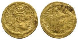 Justinian I (527-565). AV Solidus (22mm, 4.43g, 6h). Constantinople, 545-565. Helmeted and cuirassed bust facing, holding globus cruciger and shield. ...