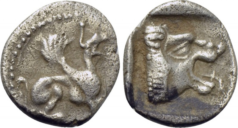 TROAS. Assos. Obol (5th century BC). 

Obv: Griffin seated right.
Rev: Head o...