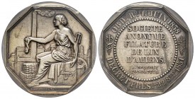 Jeton octogonal, 1851, AG 36 mm poinçon Abeille
Avers: Ouvrière assise sur une caisse devant une usine
Revers: SOCIÉTÉ ANONYME FILATURE DE LIN D'AMIEN...