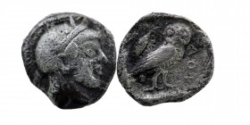 Attica, Athens. 449-404 B.C. AR obol 
Helmeted head of Athena right
Rev: AΘE, owl standing right within incuse, olive branch to left. 
Kroll 13; SNG C...