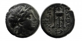 Seleukid Kingdom. Antiochos II Theos. 261-246 B.C. AE 
Antioch mint. 
Laureate head of Apollo right
Rev: tripod, monograms in fields right and left
Sp...