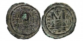 Justinian I the Great (AD 527-565). AE follis or 40 nummi
Obv: helmeted, cuirassed bust of Justinian I facing, globus cruciger in right hand, shield d...