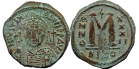 Justinian I AD 527-565. Nikomedia Follis AE
Obv: D N IVSTINI-ANVS PP AVG, cuirassed and helmeted facing bust, holding globus cruciger; cross in right ...