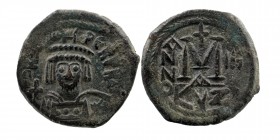 Heraclius AD 610-641. Cyzicus Follis AE
Helmeted and cuirassed facing bust, holding globus cruciger and shield with horseman motif.
Rev: Large M; cros...
