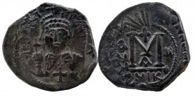 Heraclius AD 610-641. AE Follis Nikomedia
Helmeted and cuirassed bust , holding cross.
Rev: Large M Anno, A/Niko below, date left.
Possibel is double ...