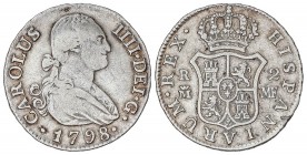 SPANISH MONARCHY: CHARLES IV
Charles IV
2 Reales. 1798. MADRID. M.F. 5,80 grs. 5,80 grs. (Rayitas y hojita en gráfila del reverso). RARA. Cal-968. M...