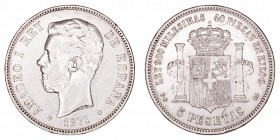 Amadeo I
5 Pesetas. AR. 1871 *18-75 DEM. 24.87g. Cal.12. Golpecito en canto. MBC-/MBC.