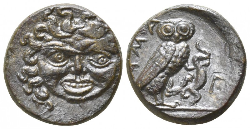 Sicily. Kamarina 420-405 BC.
Onkia AE

11mm., 1,62g.

Head of Gorgoneion fa...