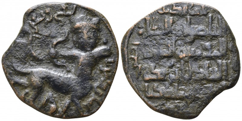 Nasir ad-din Artuq-Arslan AD 1200-1239. 
Dirham AE

25mm., 6,95g.

Crowned ...