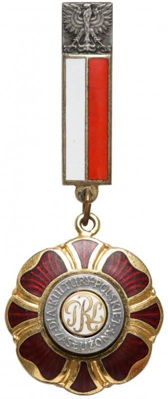 Odznaka Zasłużony dla Kultury Polskiej
 Bardzo dorby stan. Tombak, emalia; wymi...