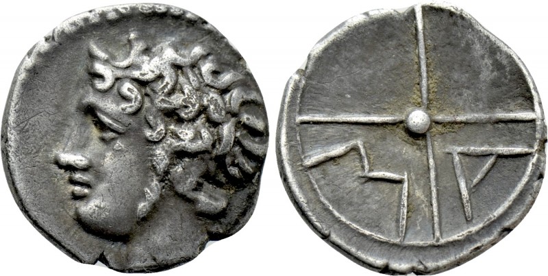 GAUL. Massalia. Obol (Circa 100-50 BC). 

Obv: Bare head of Apollo left.
Rev:...
