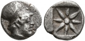 IONIA. Uncertain. 5th century BC. Hemiobol (Silver, 7 mm, 0.35 g). Head of Athena (?) to right, wearing Corinthian helmet. Rev. Star of eight rays wit...