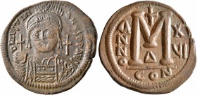 Justinian I, 527-565. Follis (Bronze, 35 mm, 20.85 g, 6 h), Constantinopolis, RY 16 = 542/3. D N IVSTINIANVS P P AVI Helmeted and cuirassed bust of Ju...