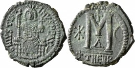 Justinian I, 527-565. Follis (Bronze, 32 mm, 18.15 g, 5 h), Theoupolis (Antiochia), 529-533. D N IVSTINIANVS P P AVS Justinian enthroned facing, holdi...