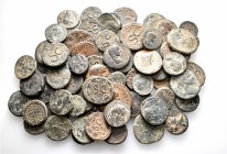 A lot containing 75 bronze coins. All: Roman Provincial. Fine to very fine. LOT SOLD AS IS, NO RETURNS. 75 coins in lot.