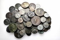 A lot containing 14 silver and 49 bronze coins. Includes: Roman Provincial and Roman Imperial. About very fine to good very fine. LOT SOLD AS IS, NO R...