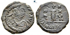 Justinian I AD 527-565. Uncertain mint. Decanummium Æ