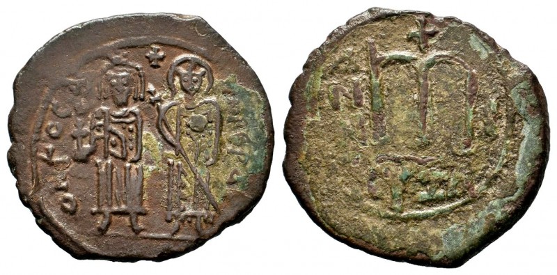 Phocas and Leontia (602-610 AD). AE Follis
Condition: Very Fine

Weight: 11,17 g...