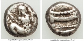 PHOENICIA. Aradus. Uncertain king (ca. 410-400 BC). AR third-stater (3.30 gm). Fine. MA (Aramaic), Ba'al-Arwad right, turned facing, dolphin upward in...