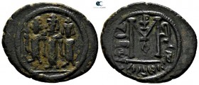 Time of Mu'awiya I ibn Abi Sufyan AD 661-680. (AH 41-60). Three Standing Figures type (Type III). Struck circa AH 65-80 (AD 685-690). Tabariyya (Tiber...