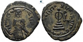 Time of `Abd al-Malik ibn Marwan AD 685-705. (AH 65-86). Standing caliph type. Dimashq (Damascus) mint. Fals Æ