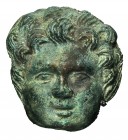 ROMA. Aplique de cabeza. Siglo II-III d.C. Cabeza de putto. Bronce. Altura 4,7 cm.