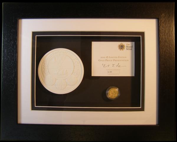 One Pound 2010 Belfast Gold Proof S.J29 and Royal Mint Crystcast plaster of the ...