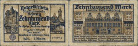 Deutschland - Nebengebiete Deutsches Reich. Danzig: 10.000 Mark 1923, Ro.796 in stark gebraucht mit diversen Einrissen und kleinen Löchern in der Mitt...