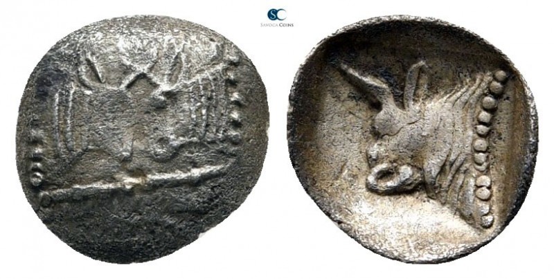 Caria. Uncertain mint 500-450 BC. 
Tetartemorion AR

9mm., 0,17g.



near...