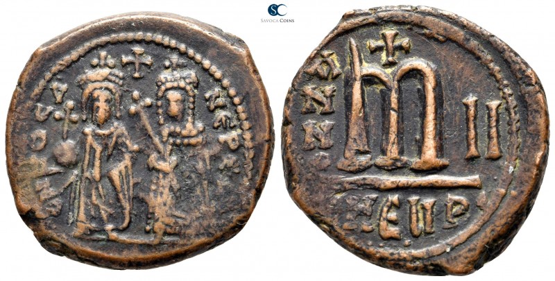 Phocas, with Leontia AD 602-610. Theoupolis (Antioch)
Follis Æ

27mm., 11,13g...