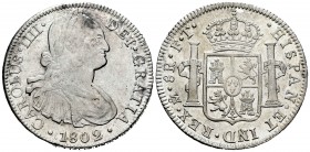 Carlos IV (1788-1808). 8 reales. 1802. México. FT. (Cal 2008-698). (Cal 2019-975). Ag. 26,86 g. Rayitas en anverso. Parte de brillo original. MBC+. Es...