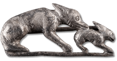 Lot 164. A magnificent Roman silver hare and hound brooch. Circa 2nd-3rd century AD.