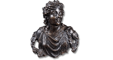 Lot 1. A fine Roman Bronze Applique Bust of a Maenad. Circa 1st-2nd century AD.