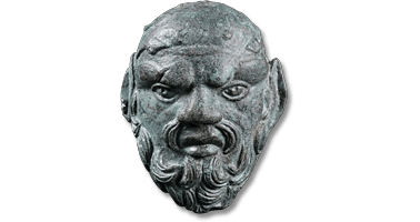 Lot 18. A large Roman Bronze Silenus Mask Applique. Circa 1st-3rd century AD.